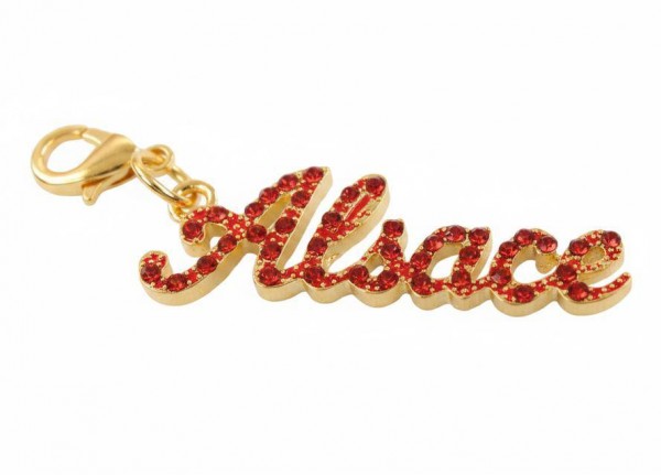 Strass Schrift "Alsace" rot Glitzer auf gold Metall, mit Karabinerhaken